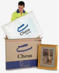 Chess Moving staff packing up painting into a box