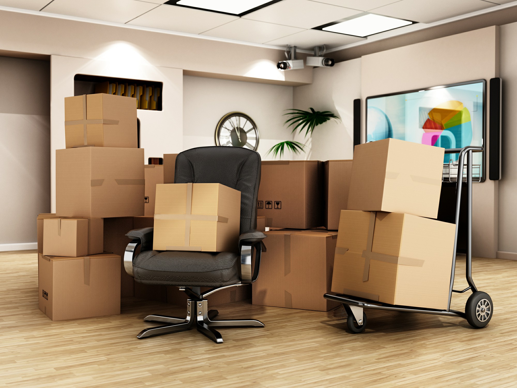 Cardboard boxes packed and stacked in a modern office space, ready for business relocation with Chess Moving.