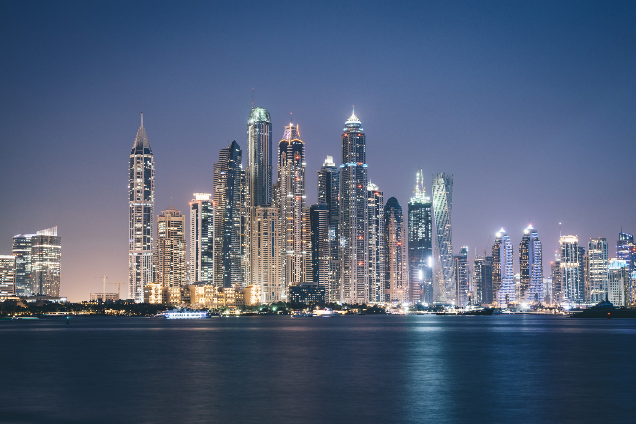 Moving from Adelaide to Dubai with Chess Moving Overseas Removalists Dubai's stunning skyline illuminated at night, showcasing its iconic skyscrapers against a dark sky.
