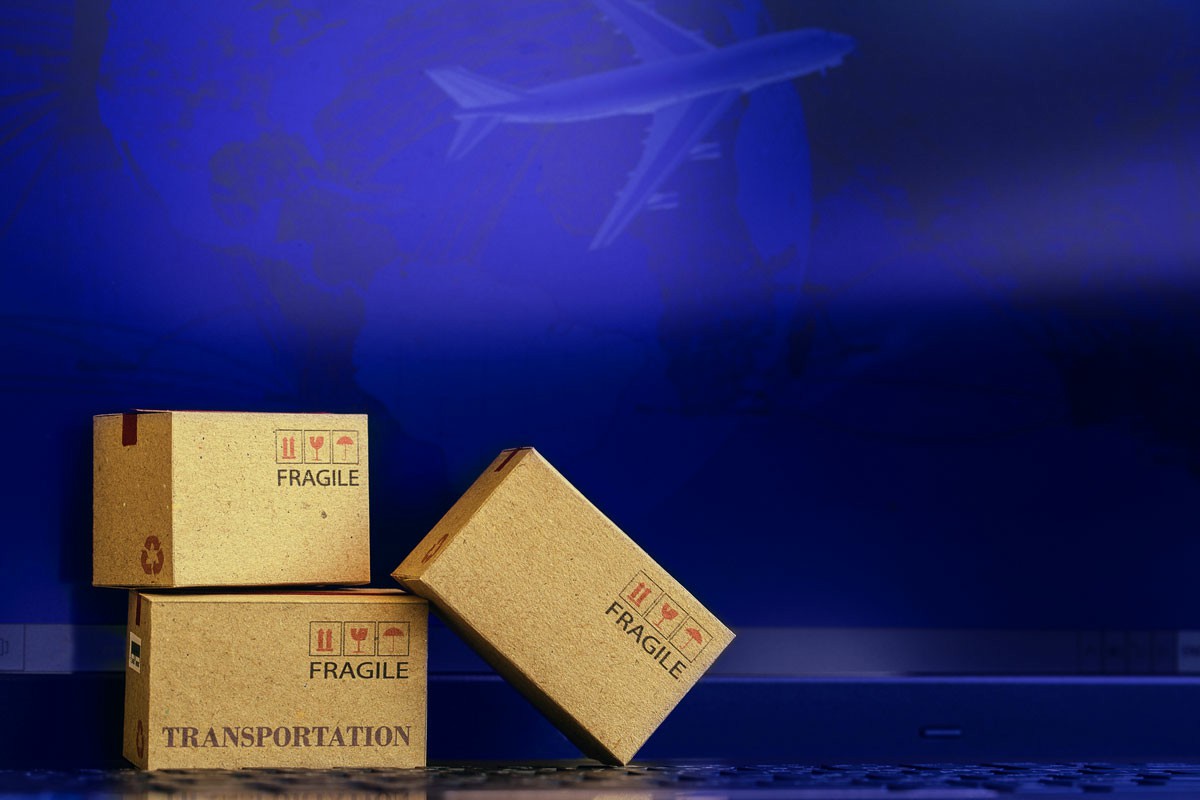 7 Tips To Minimise Stress When Moving Overseas Three boxes labeled "Transportation" set against a background featuring the same word in a repeating pattern. 7 Tips To Minimise Stress When Moving Overseas