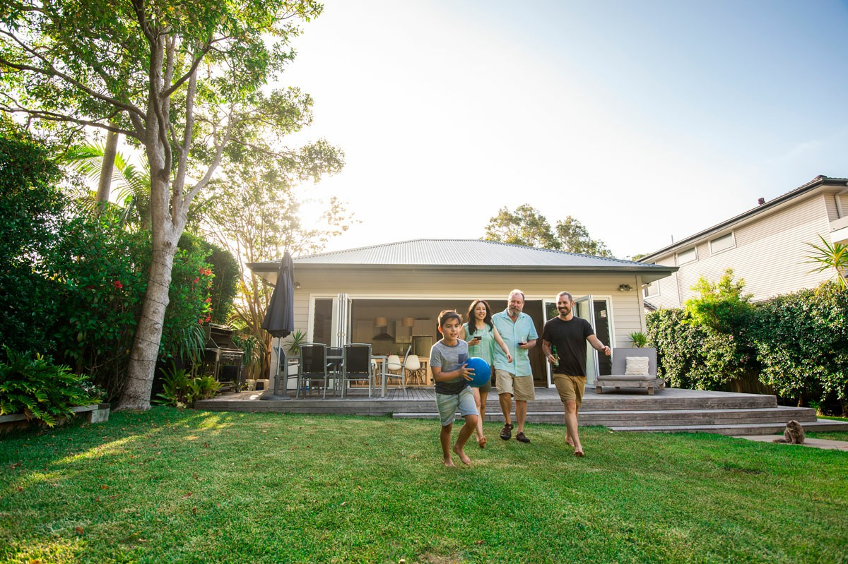 Convenience and Flexibility Professional Movers vs DIY A family strolls through their yard, reflecting on the benefits of professional movers versus DIY moving solutions; Convenience and Flexibility Professional Movers vs DIY
