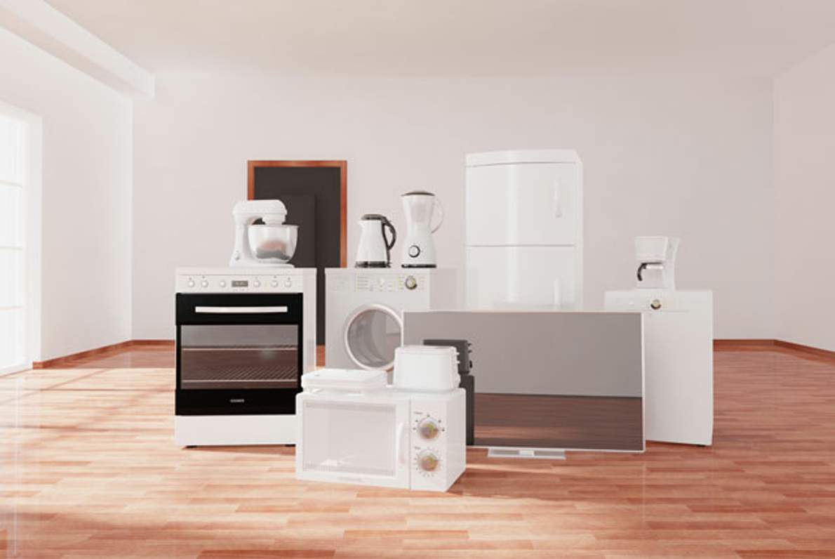 white appliances in a vacant room, ready to be moved overseas