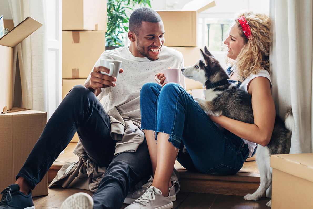 Couple and dog moving