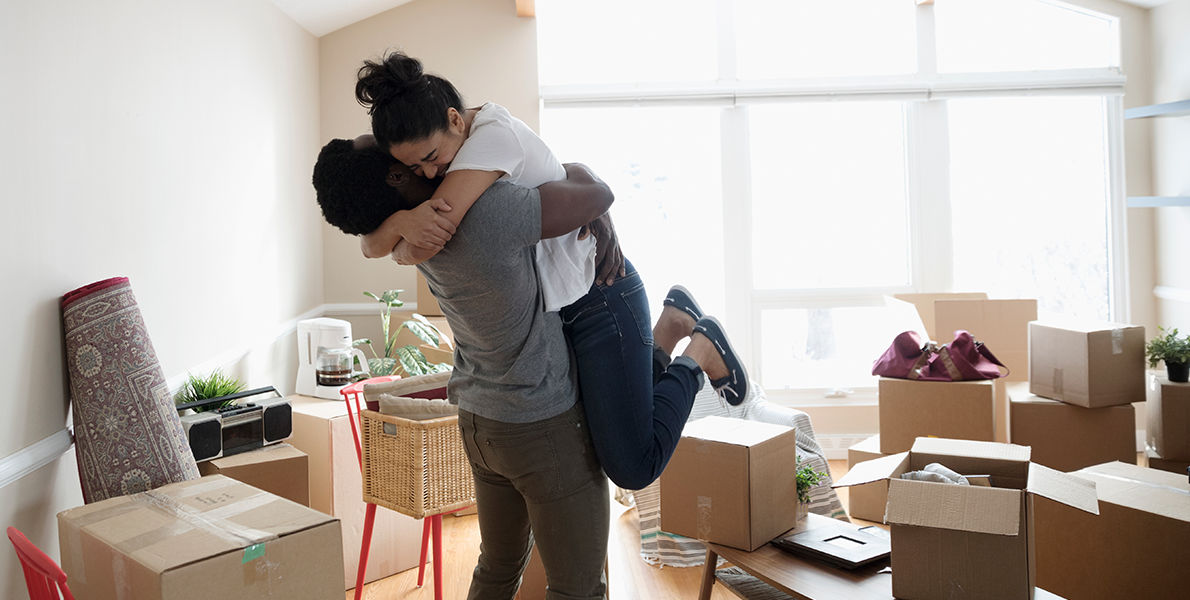 Happy couple moving home