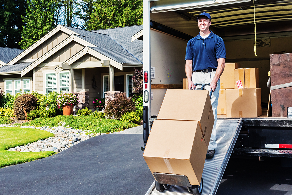 A professional removalist unload a van.