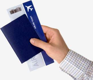 man holding a passport and an airplane ticket